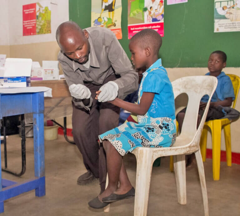 Judith Neilson Foundation. Save the kids partner. A-teacher-in-Zomba-District-provides-malaria-treatment-at-school