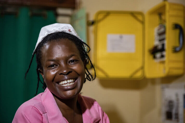 Judith Neilson Foundation - We Care Solar. health-worker-with-solar-suitcase-uganda