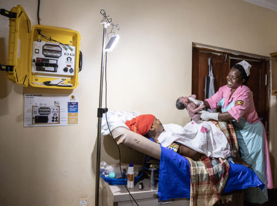 Childbirth lit by We Care Solar's solar suitcase. ©We Care Solar.